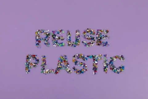 Reuse plastic text consisting of small recycled plastic pellets 스톡 사진