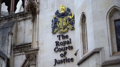 Reveal and Pull Focus on Royal Courts of Justice Crest, London Stock Footage 286134796
