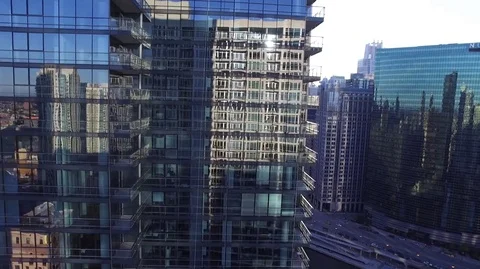 Reveal of the Chicago River downtown from behind a high rise building at sunrise Stock Footage