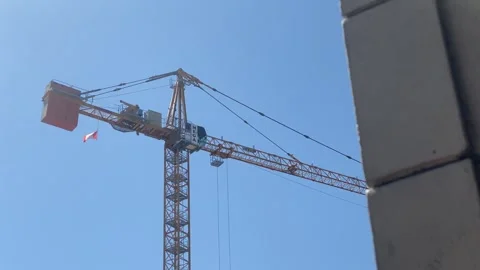 Reveal of Construction Crane with Canada Flag Stock Footage 281058551