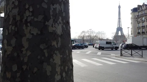 Reveal of the Eiffel Tower in the background of Parisian Traffic Stock Footage 104254205