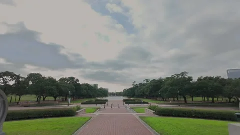 Reveal of Hermann Park through Sam Houston statue arch Stock Footage 263692306