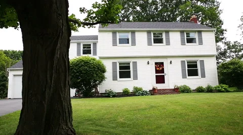 Reveal Home Through Tree in Front Yard Stock Footage 57751513