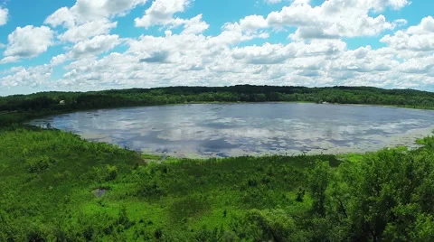 Reveal Lake Through Trees Stock Footage 57751694