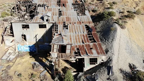 Reveal of Old Abandoned Gold Mining Mill at Gold Hill Nevada - Aerial Drone Stock Footage 111297853