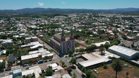 Reveal shot pulling back from San Alfonso church exposing the full city grid Stock Footage 332609676