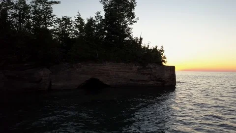 Reveal sun setting into lake Stock Footage 86477873