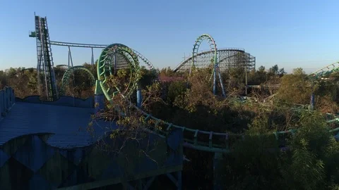 Revealing Expansive Deserted Roller Coasters In Abandoned Louisiana Theme Par Stock Footage 104954724