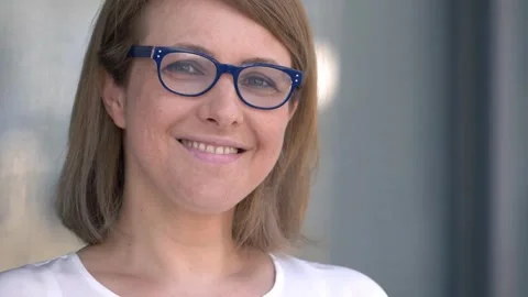 Revealing Joy: Glasses Off, Smile On Stock Footage 266232453