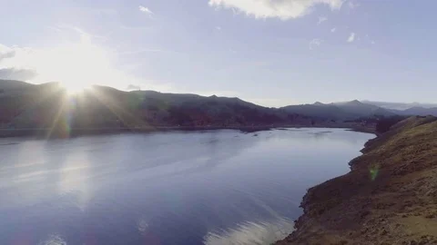 Revealing the lake behind the cliffs Video stock 82806227