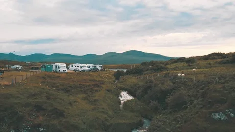 Revealing a massive waterfall splitting the steep cliffs of northern Scotland 動画素材 113746175