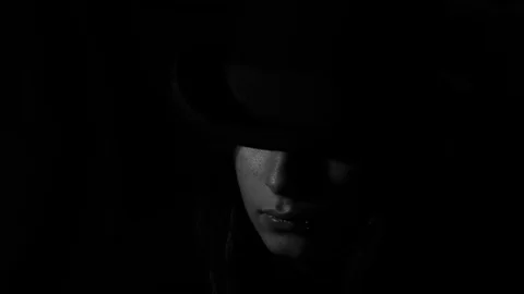 Revealing a portion of the face in the shadow Stock Footage 79667666