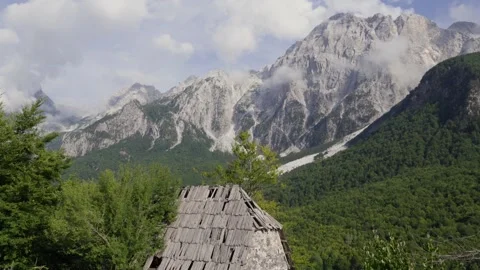 Revealing Rustic Cabin and Misty Mountains in Valbona Valley, Albania Stock Footage 338426566
