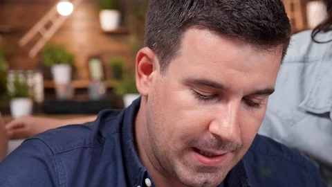 Revealing shot of creative team working and debating in front of the computer Stock Footage 112653900