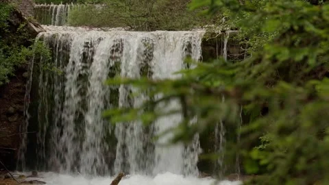Revealing shot of a small waterfall Stock Footage 283563466