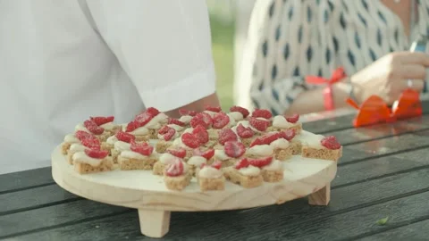 Revealing shot of strawberry biscuits on display at a wedding reception Stock Footage 317095922