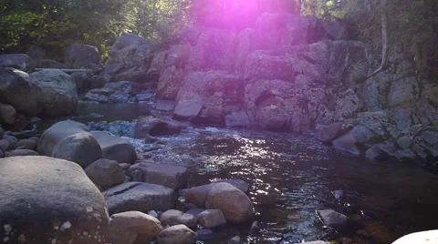 Revealing small rapids with many rocks in a valley Video stock 62424039