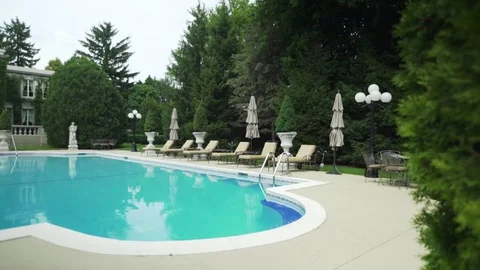 Revealing a swimming pool. 库存影片 80326936