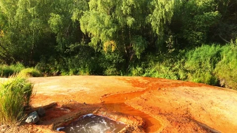 Revealing tilt down view man made hole for mineral hot springs. Hidden gems i Video stock 162553806