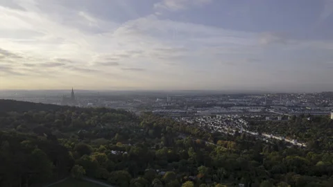 Revealing Ulm city behind forest at morning in autumn aerial time lapse Stock Footage 221352018
