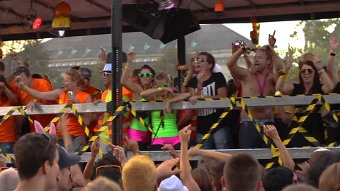 Revelers Dance and Party on a float near a crowd at Love Fest Street Parade 스톡 동영상 89778989