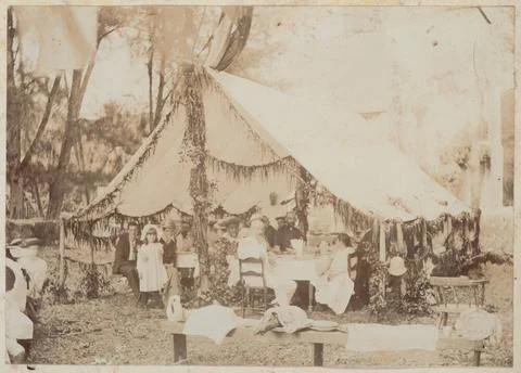 Reverend and Mrs Hutchin, Ariki Makea Takau and others seated under an awn... Stock Photos