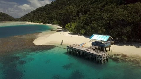 Reverse Aerial of Beautiful Remote Island at Wayag Lagoon, Raja Ampat Stock Footage 97042686