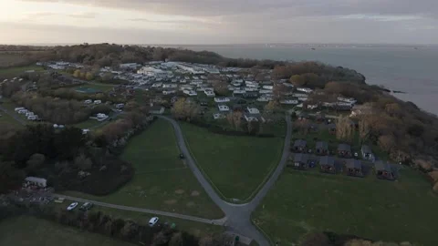 Reverse aerial drone flight over Nodes Point Holiday Park coastline Vídeos de archivo 333305248