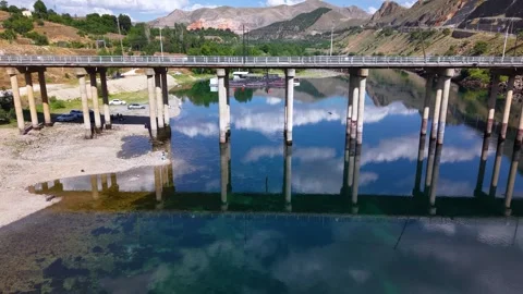 Reverse Aerial Pullback Above Historic Stone Bridge and Calm River Video stock 340183197