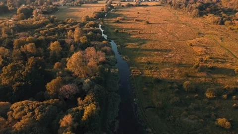 Reverse Aerial Pullback Over Stockbridge Marsh at Sunset, Hampshire, England Stock-Footage 283593215