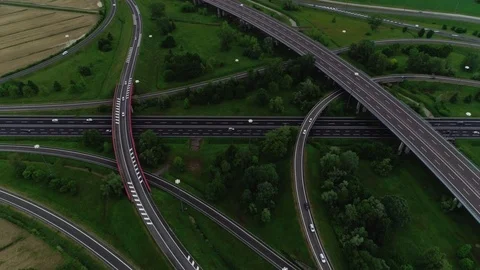 Reverse aerial shot road junction modern asphalt marking highway having few Stock Footage 111221242