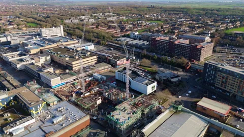 Reverse aerial view of Basildon, UK, showing a construction site and the Stock Footage 331229151