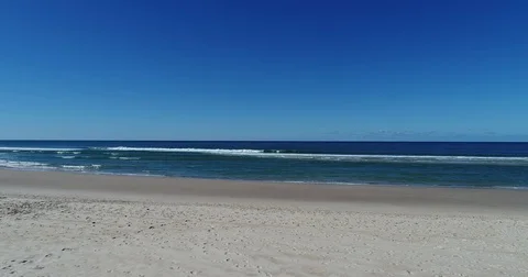 Reverse along beach by drone 4K Stock Footage 74943479