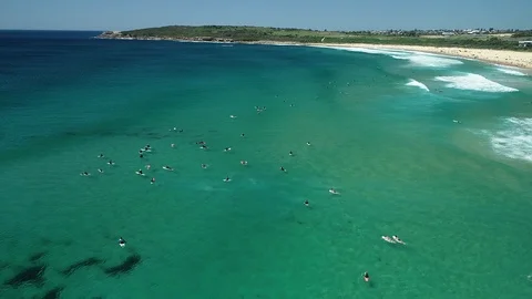 Reverse ascent from surfers beach over clear water, 4K Australia Stock Footage 102357216