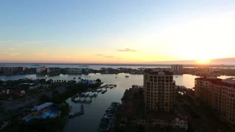 Reverse Backup 4K Drone Footage of Clearwater Beach and Bay at Sunrise Stock Footage 195130218