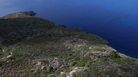 Reverse circle Aerial drone view Capel Rosso Lighthouse Giglio Island Italy Stock Footage 244945810
