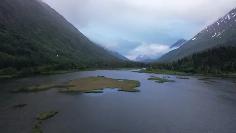Reverse on Cloudy Mountain Valley in Alaska Stock Footage 217831569