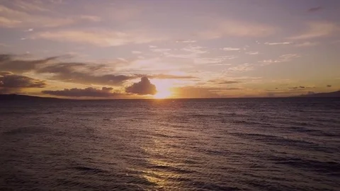 Reverse Dolly Reveal Of A Sunsetting Over A Calm OCean 스톡 동영상 83793792