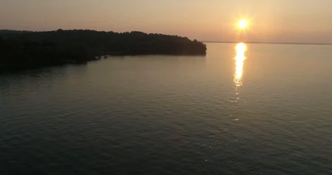 Reverse Dolly shot over the Lake at sunset Video stock 118922891