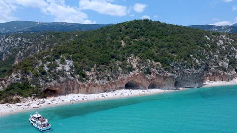 Reverse Drone Aerial Flyaway of Cala Luna Beach and Cliffs – Sardinia Stock Footage 313549001