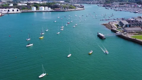 Reverse Drone Ascend Over Pontoon and Moored Boats 4k Stock Footage 320946535