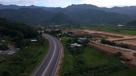 Reverse Drone Flight Over Mountain Highway and Rural Valley in Vietnam 스톡 동영상 339141169