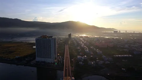 Reverse drone flight over Thuan Phuoc Bridge at sunrise, Da Nang, Vietnam Stock-Footage 340874755