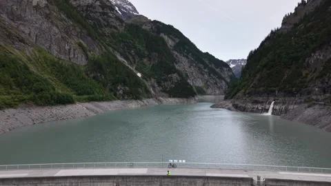 Reverse Drone Reveal of Alpine Dam and Mountain Reservoir Video stock 336366775