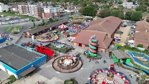 Reverse drone shot of Funlands Amusement Park, Hayling Island Stock Footage 254021755