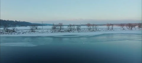 Reverse Drone Shot Of Hudson Dike On Icy St. Croix River In Hudson WI Stock Footage 229760657
