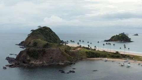 Reverse drone shot of a lonely and beautiful island Stock Footage 103454374