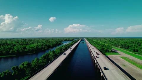 Reverse Drone Tracking of Tow Truck Towing Car on I-55 Near LaPlace, Louisiana Stock Footage 311449059