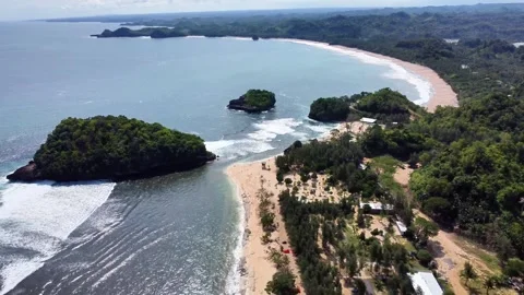 Reverse Drone View of Curved Coastline and Tropical Islets, East Java Stock Footage 310219636