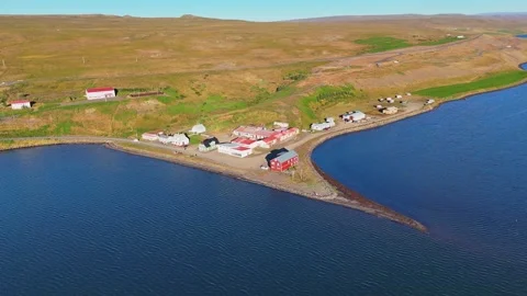 Reverse drone view of the small village of Borðeyri in the morning sun Stock-Footage 347771042